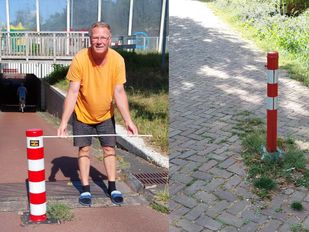 Ron Vuijk van de fietsersbond bij een van de paaltjes in Roosendaal.